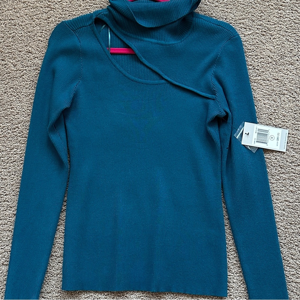 Blue turtle neck long sleeve top with cut out 
Brand: Cyrus 
Size: Medium